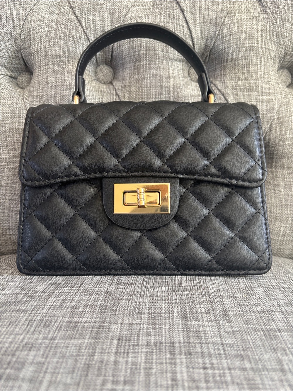 Quilted Top-Handle Black Leatherette Handbag with Gold Turn-Lock